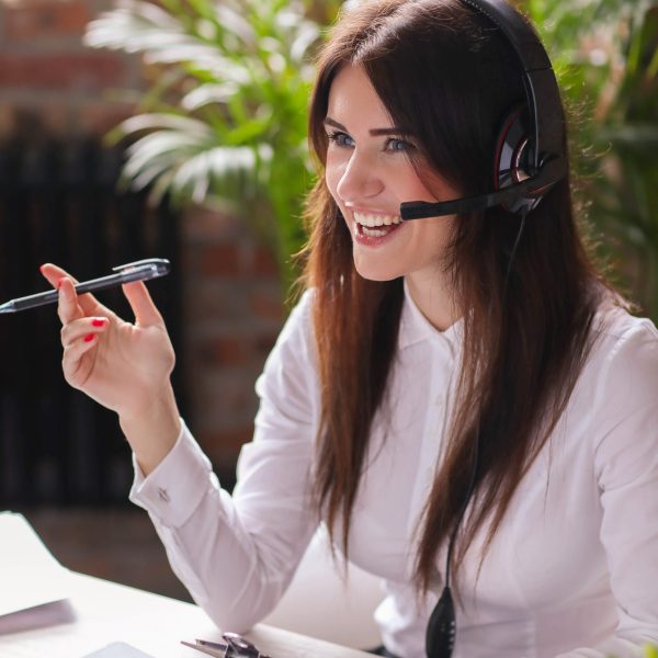 Woman working in call center as dispatcher